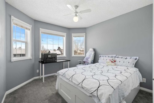 27 Henderson Road Ne, Langdon, AB - Indoor Photo Showing Bedroom