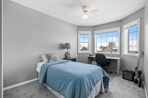 27 Henderson Road Ne, Langdon, AB - Indoor Photo Showing Bedroom
