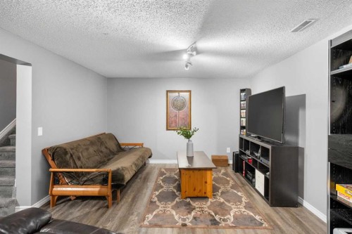 27 Henderson Road Ne, Langdon, AB - Indoor Photo Showing Living Room