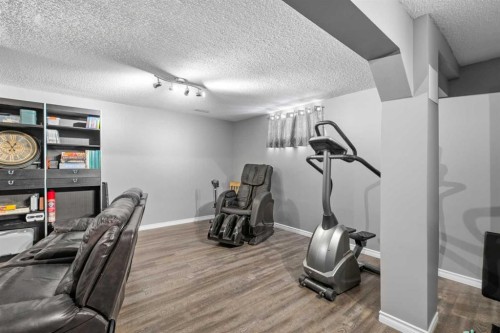 27 Henderson Road Ne, Langdon, AB - Indoor Photo Showing Gym Room