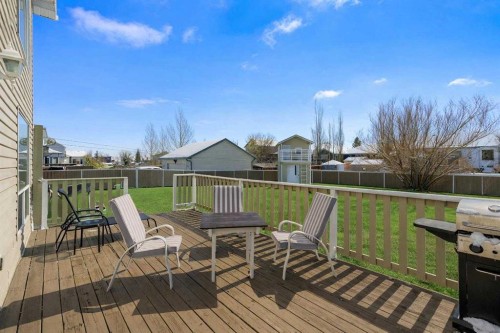 27 Henderson Road Ne, Langdon, AB - Outdoor With Deck Patio Veranda