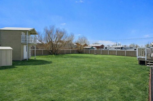 27 Henderson Road Ne, Langdon, AB - Outdoor With Backyard