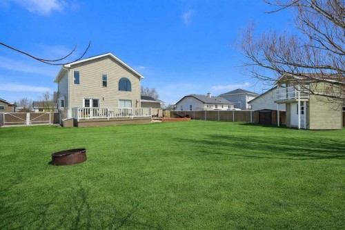 27 Henderson Road Ne, Langdon, AB - Outdoor With Deck Patio Veranda With Backyard