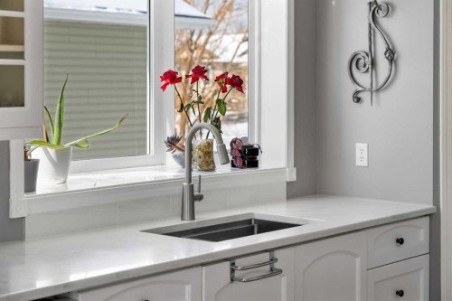 27 Henderson Road Ne, Langdon, AB - Indoor Photo Showing Kitchen With Double Sink
