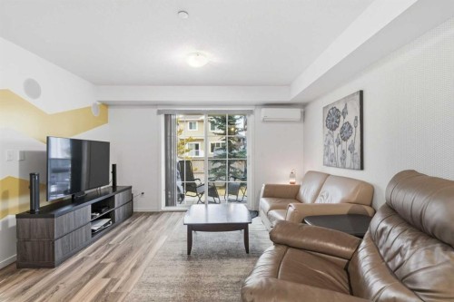 1102-755 Copperpond Boulevard Se, Calgary, AB - Indoor Photo Showing Living Room