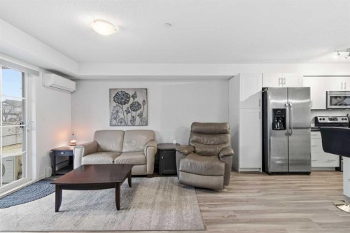 1102-755 Copperpond Boulevard Se, Calgary, AB - Indoor Photo Showing Living Room