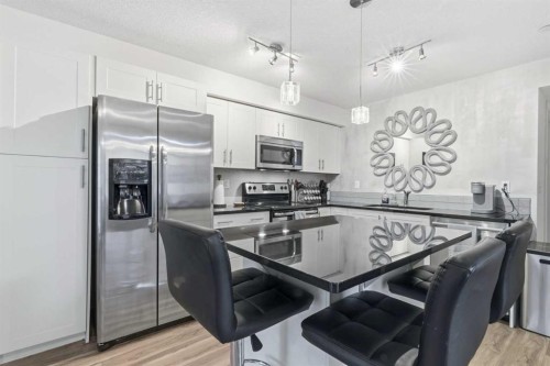 1102-755 Copperpond Boulevard Se, Calgary, AB - Indoor Photo Showing Kitchen With Stainless Steel Kitchen With Upgraded Kitchen