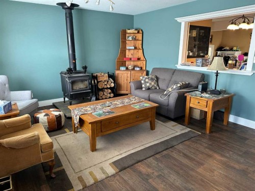 2123 16 Avenue, Didsbury, AB - Indoor Photo Showing Living Room With Fireplace