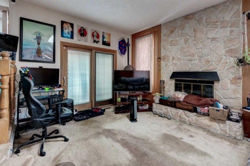720 22 Avenue Nw, Calgary, AB - Indoor Photo Showing Other Room With Fireplace