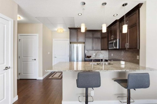 705-24 Varsity Estates Circle Nw, Calgary, AB - Indoor Photo Showing Kitchen With Stainless Steel Kitchen With Double Sink With Upgraded Kitchen