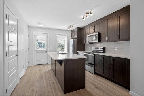 306-338 Seton Circle Se, Calgary, AB - Indoor Photo Showing Kitchen