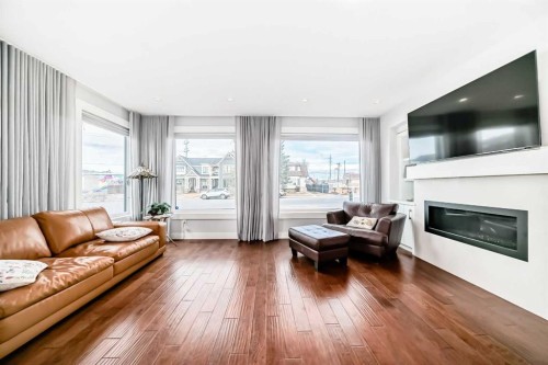 4640 15 Avenue Nw, Calgary, AB - Indoor Photo Showing Living Room With Fireplace