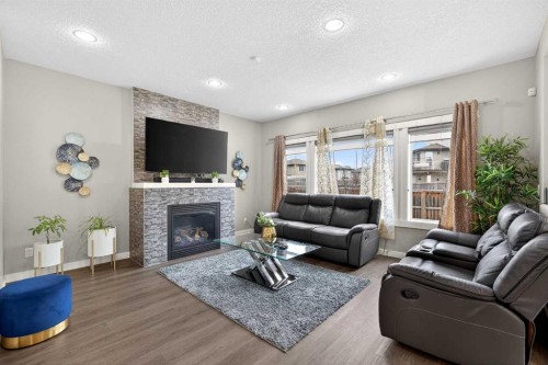 148 Walden Square Se, Calgary, AB - Indoor Photo Showing Living Room With Fireplace