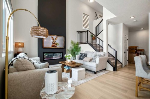 3085 Key Drive Sw, Airdrie, AB - Indoor Photo Showing Living Room With Fireplace