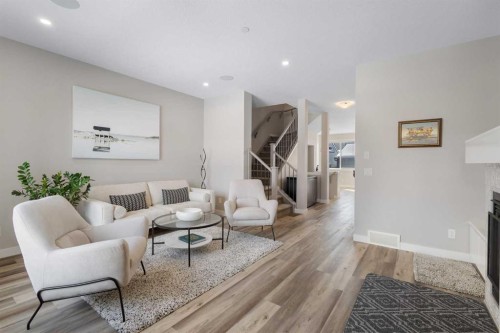 45 Howse Street Ne, Calgary, AB - Indoor Photo Showing Living Room With Fireplace