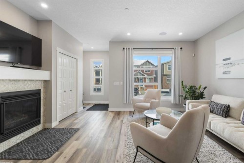 45 Howse Street Ne, Calgary, AB - Indoor Photo Showing Living Room With Fireplace