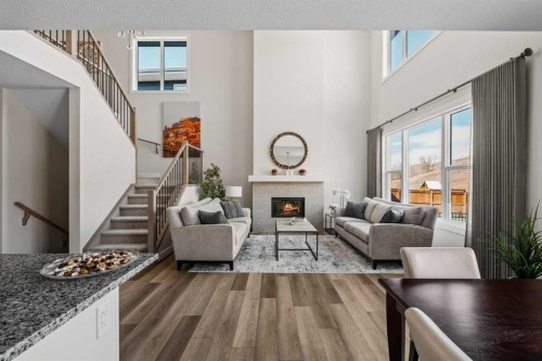24 Cranbrook Cape Se, Calgary, AB - Indoor Photo Showing Living Room With Fireplace