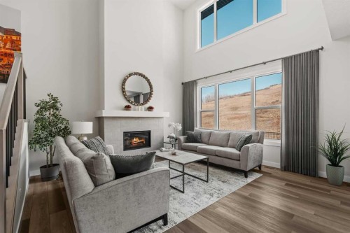 24 Cranbrook Cape Se, Calgary, AB - Indoor Photo Showing Living Room With Fireplace