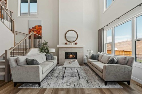 24 Cranbrook Cape Se, Calgary, AB - Indoor Photo Showing Living Room With Fireplace