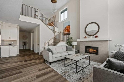 24 Cranbrook Cape Se, Calgary, AB - Indoor Photo Showing Living Room With Fireplace