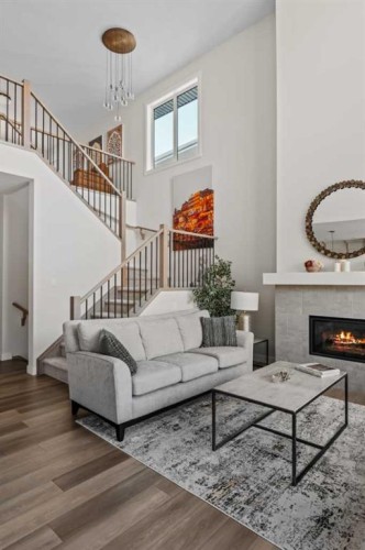 24 Cranbrook Cape Se, Calgary, AB - Indoor Photo Showing Living Room With Fireplace