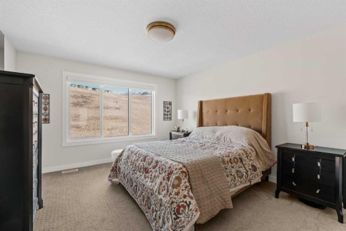 24 Cranbrook Cape Se, Calgary, AB - Indoor Photo Showing Bedroom
