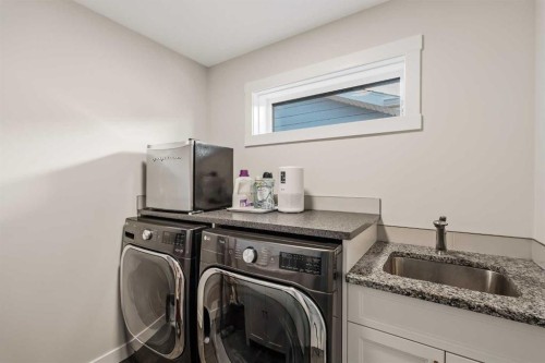 24 Cranbrook Cape Se, Calgary, AB - Indoor Photo Showing Laundry Room