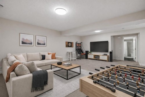24 Cranbrook Cape Se, Calgary, AB - Indoor Photo Showing Living Room
