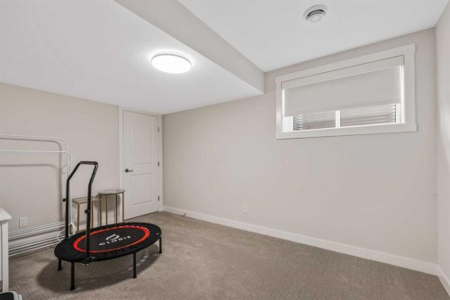 24 Cranbrook Cape Se, Calgary, AB - Indoor Photo Showing Other Room