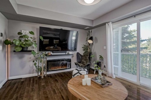 10 Chaparral Ridge Park Se, Calgary, AB - Indoor Photo Showing Living Room With Fireplace