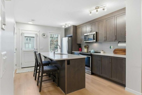 410-338 Seton Circle Se, Calgary, AB - Indoor Photo Showing Kitchen With Upgraded Kitchen