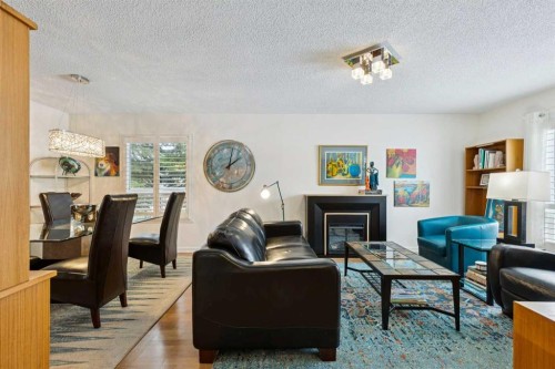 48 Deer Ridge Close Se, Calgary, AB - Indoor Photo Showing Living Room With Fireplace