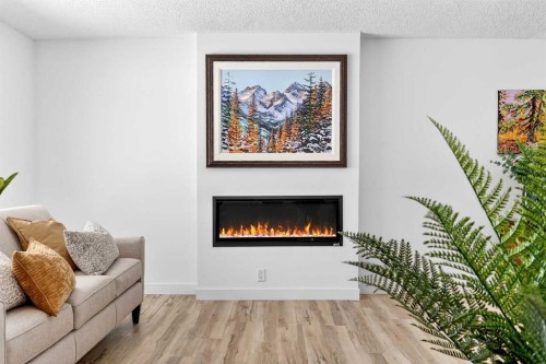 4311 Dovercrest Drive Se, Calgary, AB - Indoor Photo Showing Living Room With Fireplace