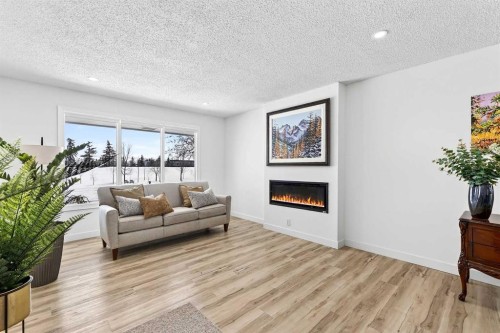 4311 Dovercrest Drive Se, Calgary, AB - Indoor Photo Showing Living Room With Fireplace