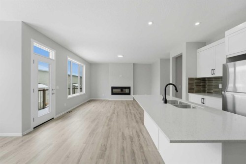 40 Cityline Manor Ne, Calgary, AB - Indoor Photo Showing Kitchen With Fireplace With Double Sink