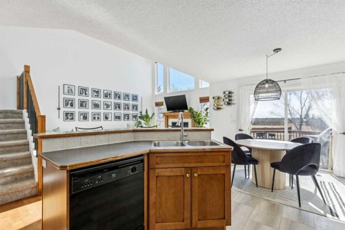 214 Cougarstone Circle Sw, Calgary, AB - Indoor Photo Showing Kitchen With Double Sink