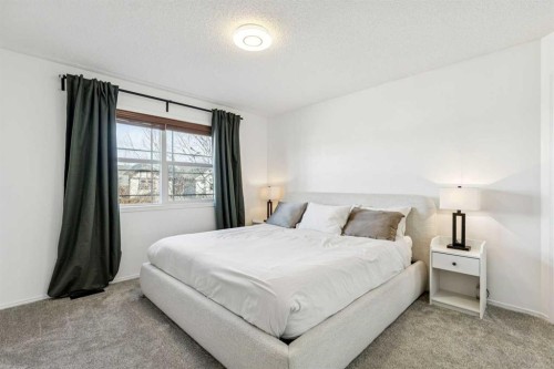 214 Cougarstone Circle Sw, Calgary, AB - Indoor Photo Showing Bedroom