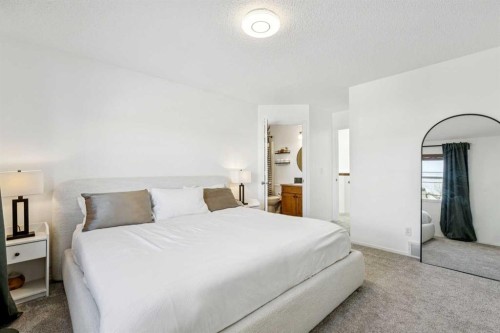 214 Cougarstone Circle Sw, Calgary, AB - Indoor Photo Showing Bedroom