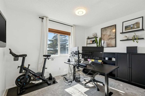 214 Cougarstone Circle Sw, Calgary, AB - Indoor Photo Showing Gym Room