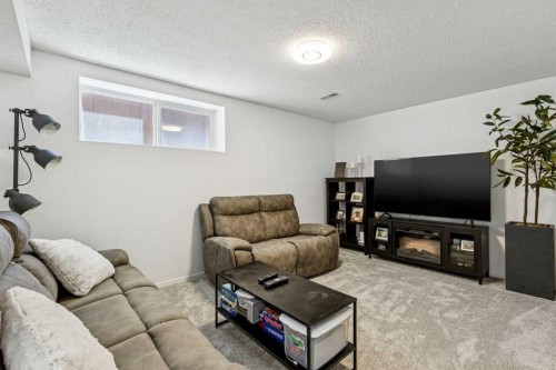 214 Cougarstone Circle Sw, Calgary, AB - Indoor Photo Showing Living Room