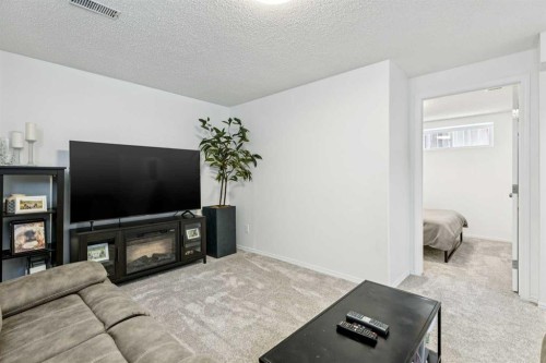 214 Cougarstone Circle Sw, Calgary, AB - Indoor Photo Showing Living Room