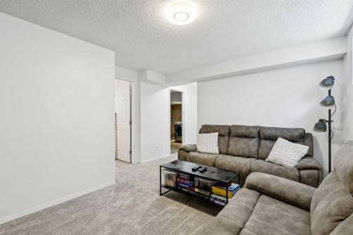 214 Cougarstone Circle Sw, Calgary, AB - Indoor Photo Showing Living Room