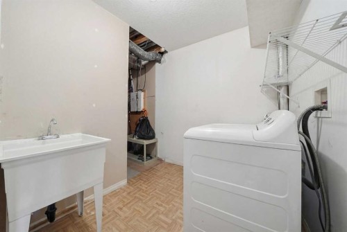 27 Saddleland Way Ne, Calgary, AB - Indoor Photo Showing Laundry Room