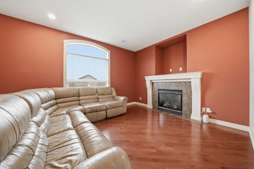 27 Saddleland Way Ne, Calgary, AB - Indoor Photo Showing Living Room With Fireplace