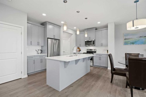 79 Mist Mountain Rise, Okotoks, AB - Indoor Photo Showing Kitchen With Upgraded Kitchen