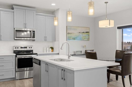 79 Mist Mountain Rise, Okotoks, AB - Indoor Photo Showing Kitchen With Double Sink With Upgraded Kitchen