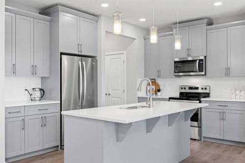 79 Mist Mountain Rise, Okotoks, AB - Indoor Photo Showing Kitchen With Upgraded Kitchen