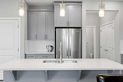 79 Mist Mountain Rise, Okotoks, AB - Indoor Photo Showing Kitchen With Double Sink With Upgraded Kitchen