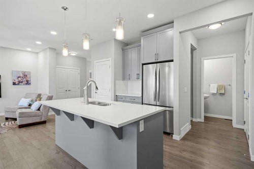 79 Mist Mountain Rise, Okotoks, AB - Indoor Photo Showing Kitchen With Double Sink With Upgraded Kitchen