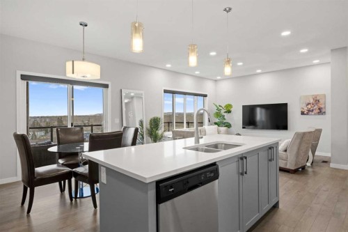 79 Mist Mountain Rise, Okotoks, AB - Indoor Photo Showing Kitchen With Double Sink